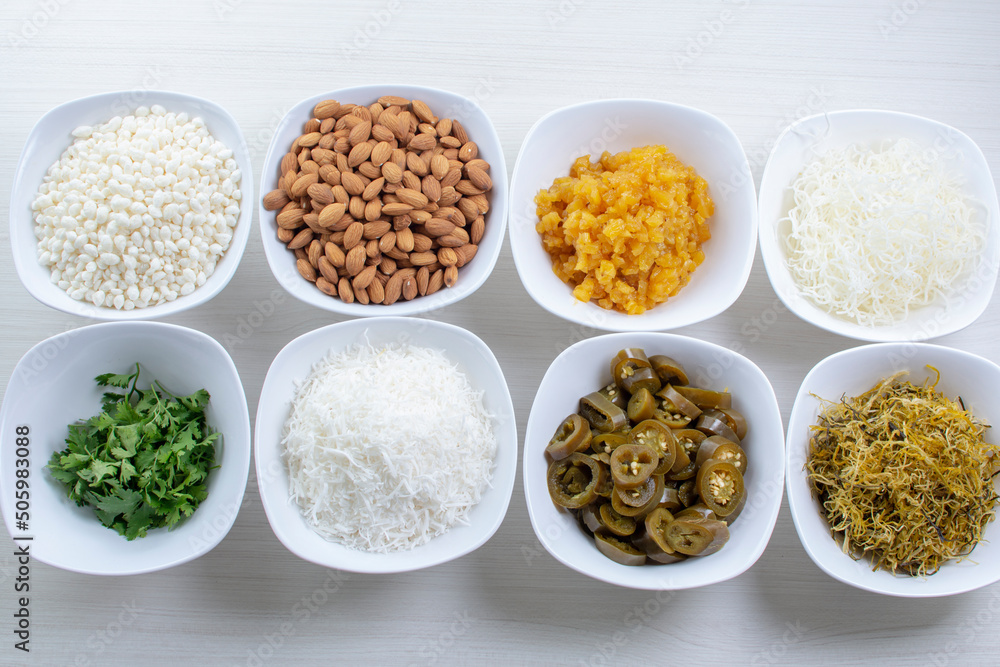 Variety of topping, ingredients to accompany sushi, displayed in white container Variety of topping, ingredients to accompany sushi, displayed in white container