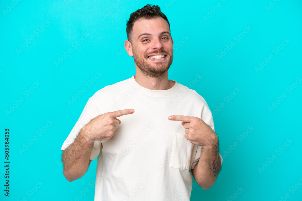 Young Brazilian man isolated on blue background with surprise facial expression Young Brazilian man isolated on blue background with surprise facial expression