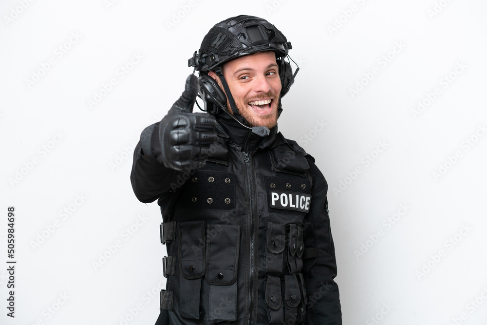 Brazilian soldier man isolated on white background with thumbs up because something good has happened Brazilian soldier man isolated on white background with thumbs up because something good has happened