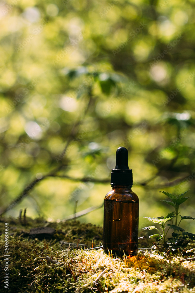 bottle mockup with dropper on nature background. bottle mockup with dropper on nature background.