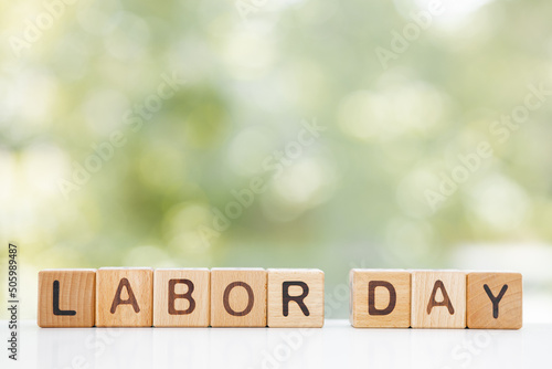 Labor day concept - present, tie on rustic wood background