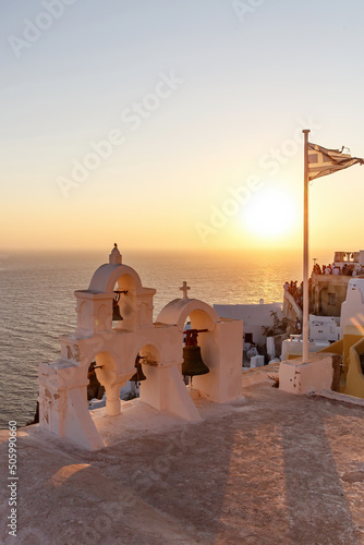 Bell tower of the traditional greek church during sunset, Greece.