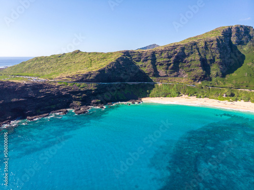 Aerial view of Makapuu Beach bay and Makapuu lookout with cliffs 