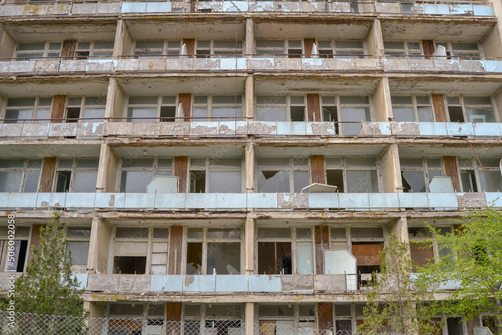 The destruction of a multi-storey building, view of the facade wall. The destruction of a multi-storey building, view of the facade wall.