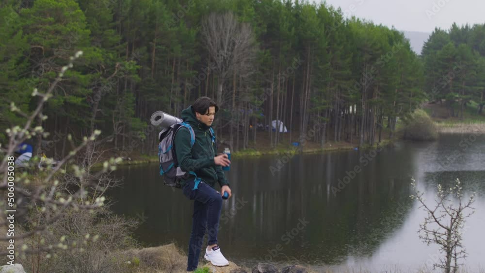 Backpacking man trekking.
The backpacker arrives on foot, stops and rests with a drink of water from his thermos.
Backpacking man trekking.
The backpacker arrives on foot, stops and rests with a drink of water from his thermos.