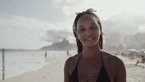 Latin young girl, famous beach Rio de Janeiro, Brazil. Latin summer vacation holiday.