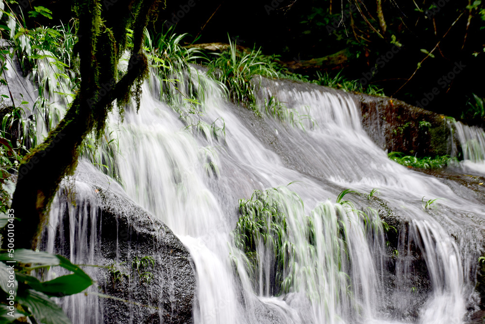 A single-tiered waterfall with bright white streams.