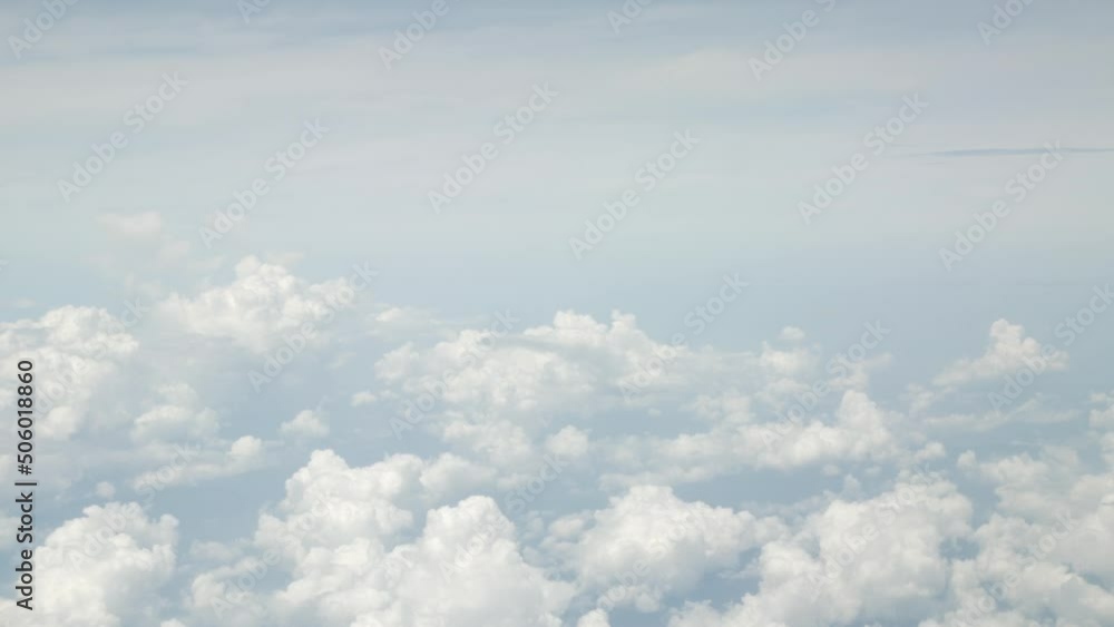 view of sky with white puffy cloud and sun light above sky.cloudscape in summer
