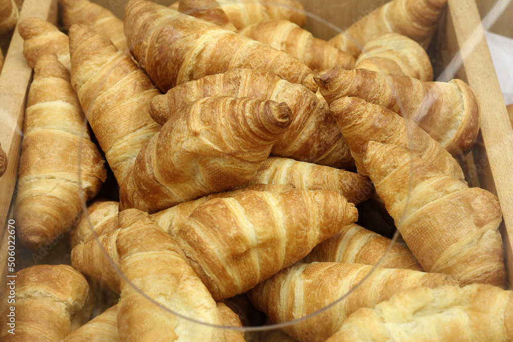 sale of fresh croissants in the store sale of fresh croissants in the store