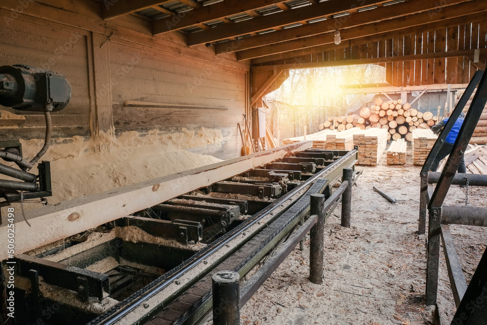 The process of processing wood at the sawmill. Timber industry