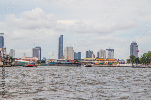 A Tug boat with a cargo ship on the Chao Phraya River in Bangkok Thailand Southeast Asia
