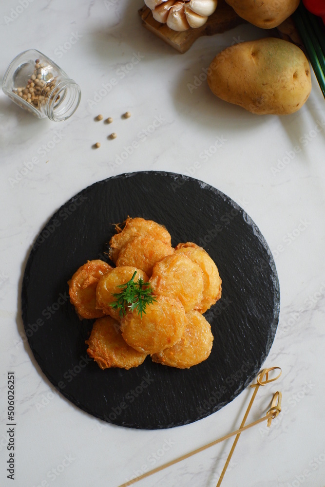 a plate of fried potato cake named perkedel kentang in Bahasa a plate of fried potato cake named perkedel kentang in Bahasa