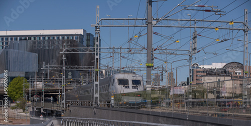 Photography A long-distance train X2000 type train leaving the central station a sunny day i