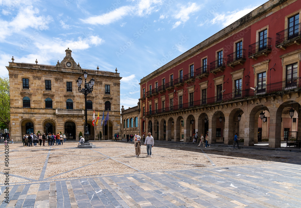 the Plaza Mayor Square with people enjoying a sunny day out in the historic city center of Gijon