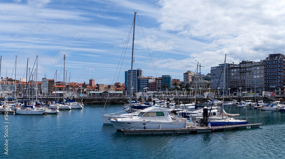 view of the sports marina and harbor in Gijon with many sailboats at the docks