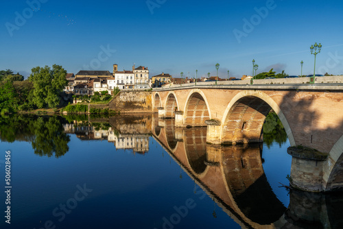 view of the Dordogne River and old stone bridge leading to Bergerac photo