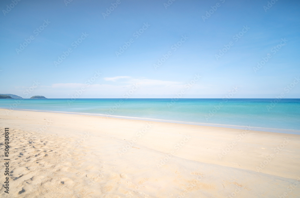 Tropical sandy beach with blue ocean and blue sky background image for nature background or summer background.Phuket thailand Tropical sandy beach with blue ocean and blue sky background image for nature background or summer background.Phuket thailand