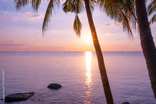 Fototapeta Naklejka Na Ścianę i Meble -  Silhouette coconut palm trees at sunset or sunrise sky over sea Amazing light nature colorful landscape Beautiful light nature sky and clouds