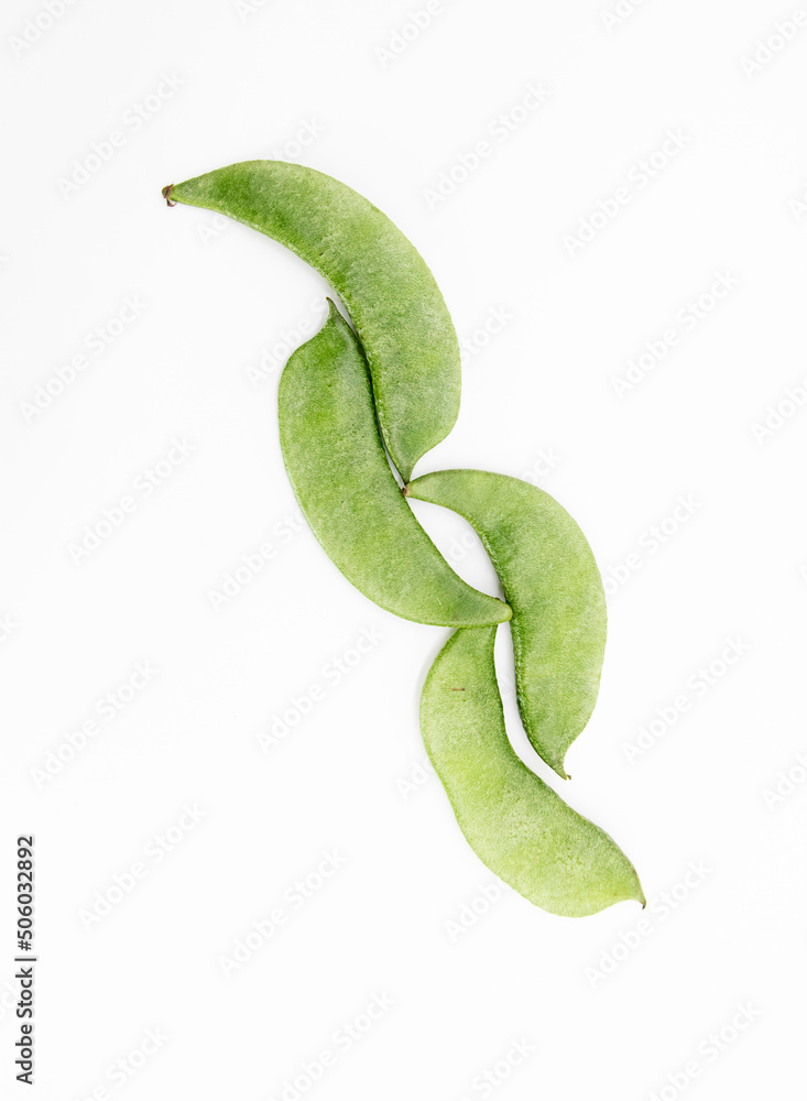 Lima beans or Hyacinth beans over on white background, top view Lima beans or Hyacinth beans over on white background, top view