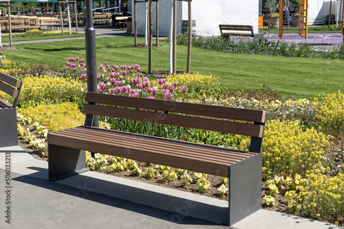 Modern garden bench in the park photo