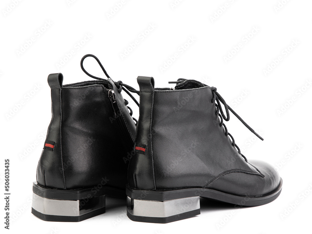Women's autumn black leather jodhpur boots with black sole isolated on white background. Back side view. Fashion shoes. Photoshoot for shoe shop Women's autumn black leather jodhpur boots with black sole isolated on white background. Back side view. Fashion shoes. Photoshoot for shoe shop