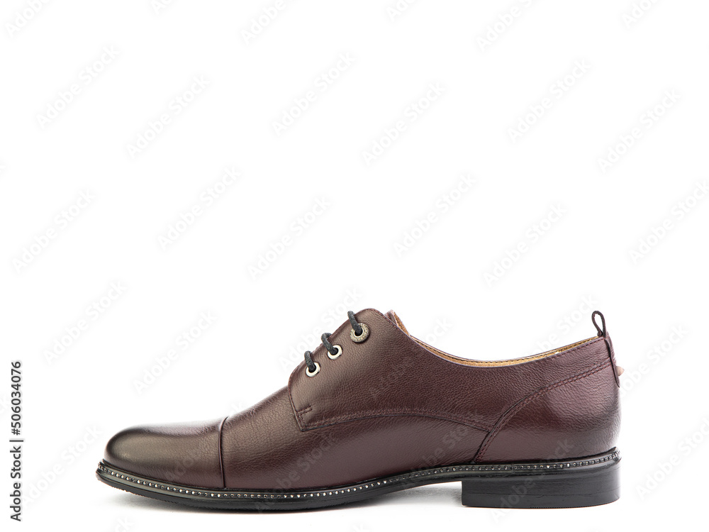 A classic leather elegant men's shoes isolated white background. Groom's stylish brown shoes. Isolated object close up on white background. A classic leather elegant men's shoes isolated white background. Groom's stylish brown shoes. Isolated object close up on white background.