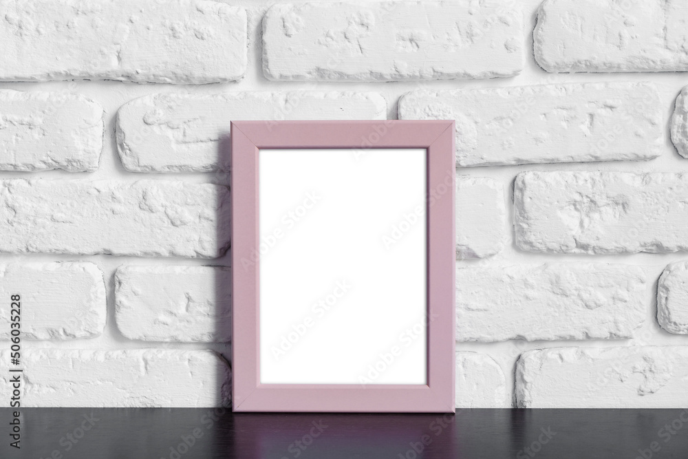 Photo frame with copy space against white brick wall Photo frame with copy space against white brick wall