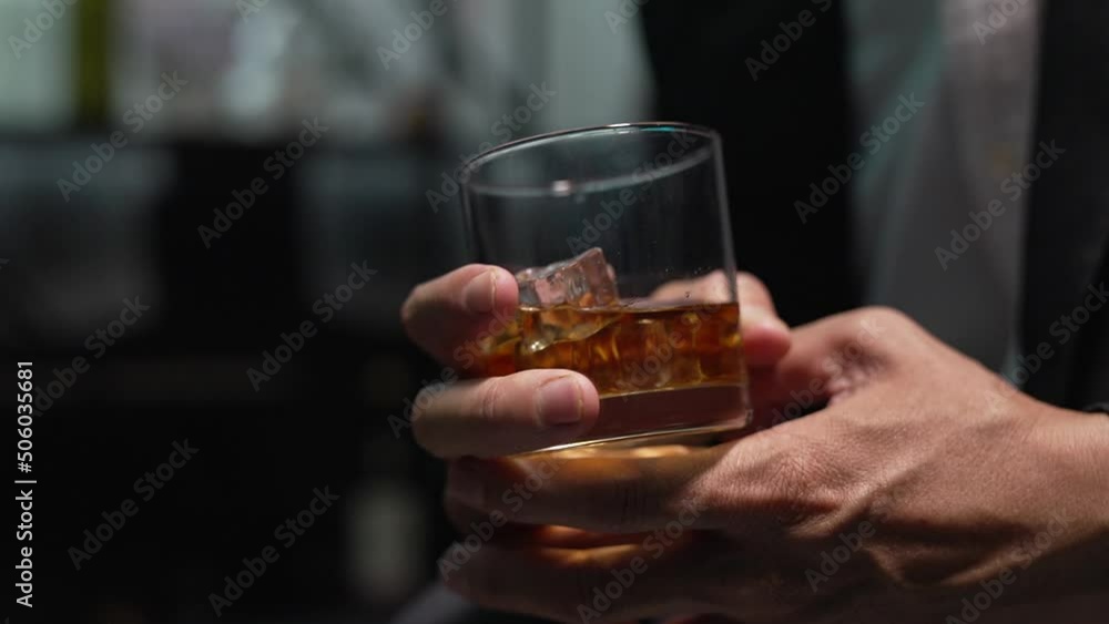 businessman holding whiskey, a restaurant businessman holding whiskey, a restaurant