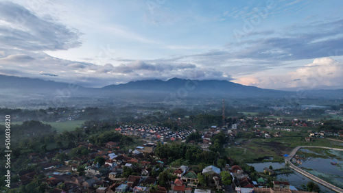 Aerial view of Situ Bagendit is a famous tourist spot in Garut with mountain view.  photo