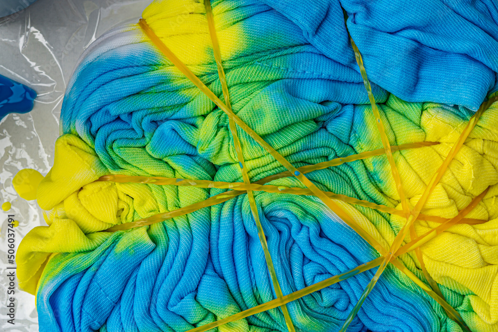 wrinkled fabric yellow and blue texture close up