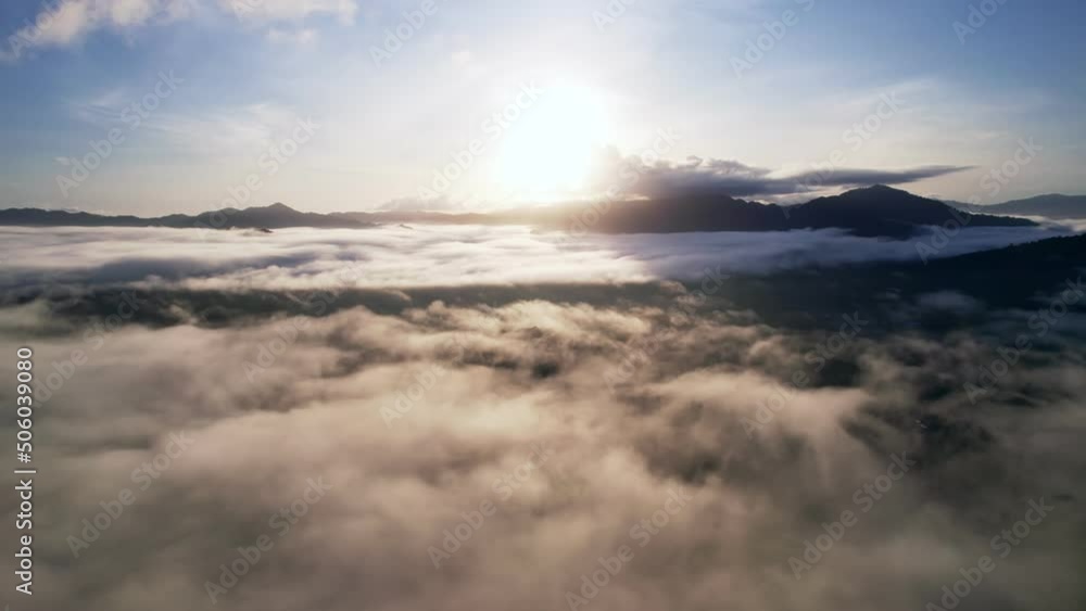 Drone view flying over sea of mist or fog Landscape High angle view Dynamic aerial shot Amazing nature mountain view beautiful sunrise sky in the morning sunrise,Thailand travel and nature environment Drone view flying over sea of mist or fog Landscape High angle view Dynamic aerial shot Amazing nature mountain view beautiful sunrise sky in the morning sunrise,Thailand travel and nature environment