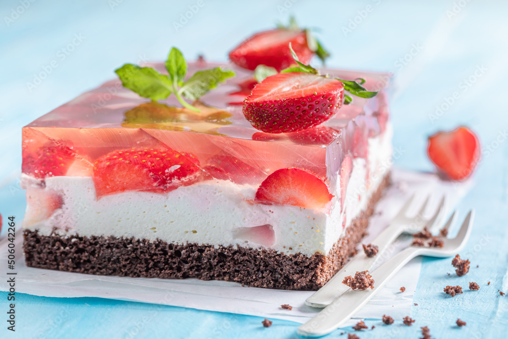 Fresh strawberry jelly cake with fruity layer surrounded by jelly. Fresh strawberry jelly cake with fruity layer surrounded by jelly.