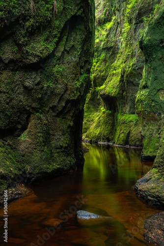 The devils pulpit , Scotland , Rock formation and stream .