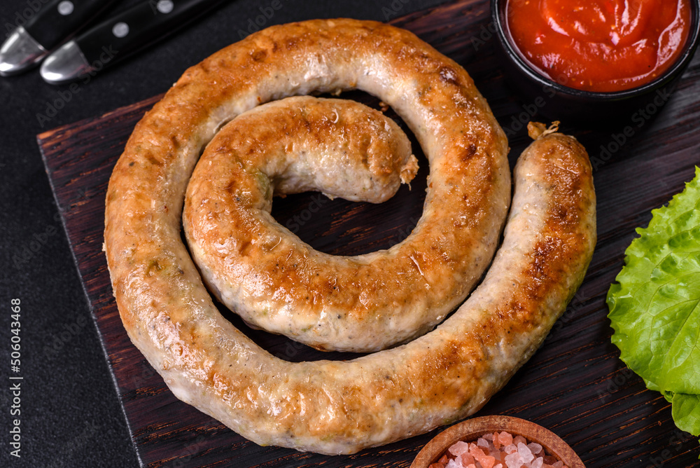 Baked homemade sausage with spices and herbs, close up