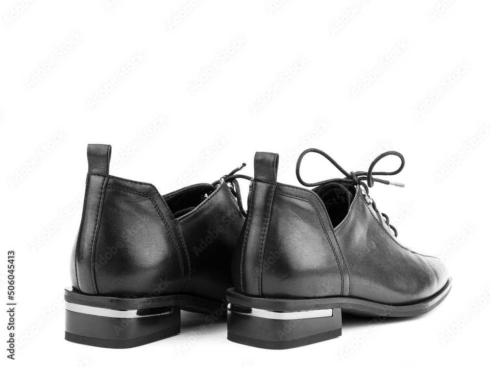 Women's autumn leather jodhpur boots with laces and average heels, isolated white background. Back side view. Fashion shoes. Photoshoot for shoe shop