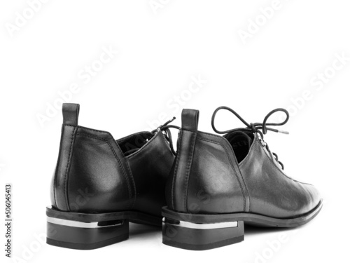 Obraz na płótnie Women's autumn leather jodhpur boots with laces and average heels, isolated white background. Back side view. Fashion shoes. Photoshoot for shoe shop w salonie