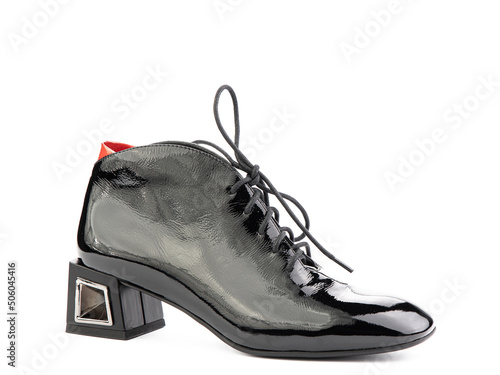Obraz na płótnie Women's autumn ankle black leather boots with black zip and average heels, isolated white background. Right side view. Fashion shoes. w salonie