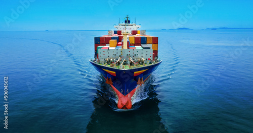 Stern of large cargo ship import export container box on the ocean sea on blue sky back ground concept transportation logistic and service to customer and supply change