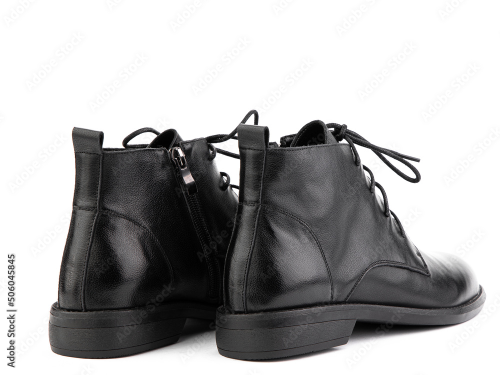 Women's autumn black leather jodhpur boots with laces and average heels, isolated white background. Back side view. Fashion shoes.