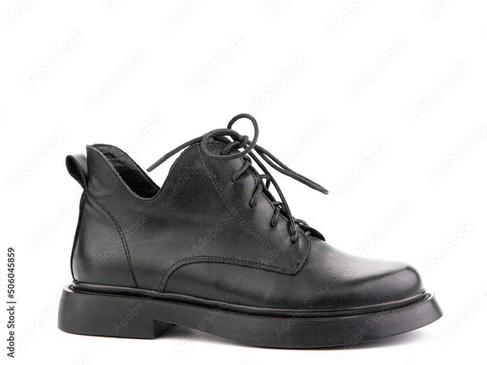Women's autumn black leather jodhpur boots with laces and average heels, isolated white background. Right side view. Fashion shoes.