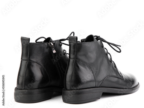 Obraz na płótnie Women's autumn black leather jodhpur boots with laces and average heels, isolated white background. Back side view. Fashion shoes. w salonie