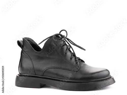 Women's autumn black leather jodhpur boots with laces and average heels, isolated white background. Right side view. Fashion shoes.
