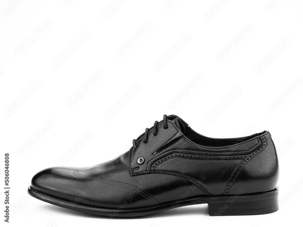 A pair of classic leather elegant men's shoes isolated white background. Groom's stylish black shoes. Isolated object close up on white background. A pair of classic leather elegant men's shoes isolated white background. Groom's stylish black shoes. Isolated object close up on white background.