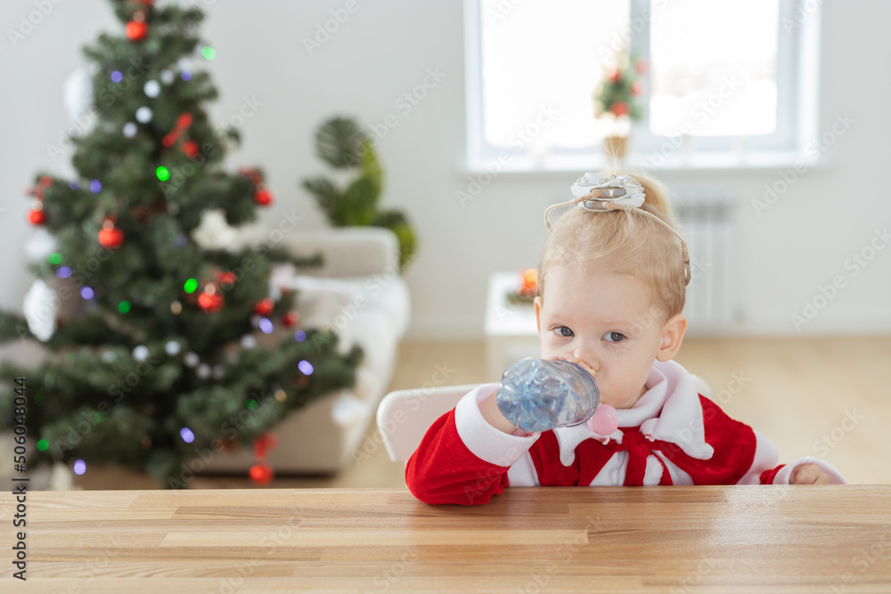 Child with cochlear implant hearing aid in christmas living room copy space - deafness treatment and medical innovative technologies Child with cochlear implant hearing aid in christmas living room copy space - deafness treatment and medical innovative technologies