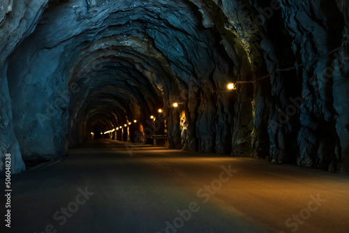 old tunnel for cars, in orange and blue light, long perspective