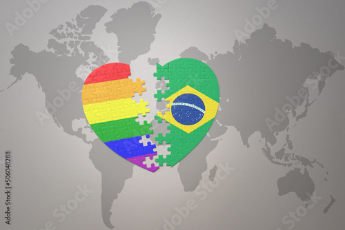 puzzle heart with the rainbow gay flag and brazil on a world map background. Concept.
