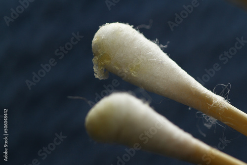 Macro texture of earwax or cerumen on cotton buds