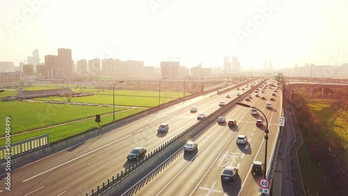 aerial view of traffic on elevated expressway in hangzhou qianjiang centry city at sunset
 photo