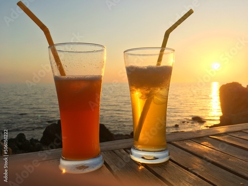 Frozen cocktail glasses over sunset