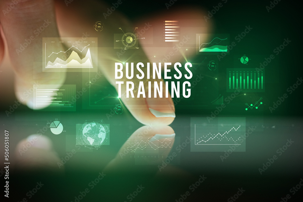 Finger touching tablet with business graphs and icons concept Finger touching tablet with business graphs and icons concept